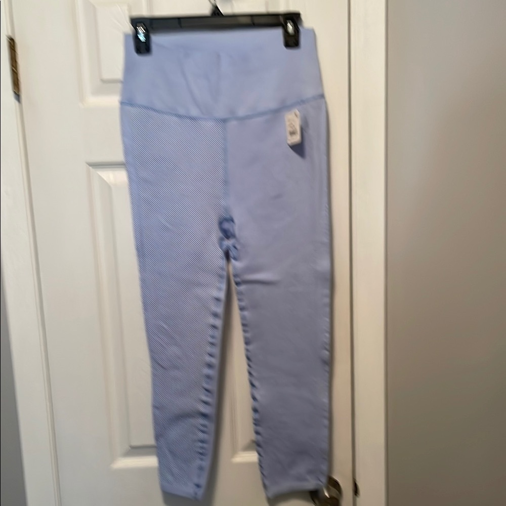 Newer tags women’s size large Free People, ribbed leggings and a light baby blue
